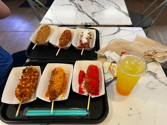 Marble table with corn dog flight and drink